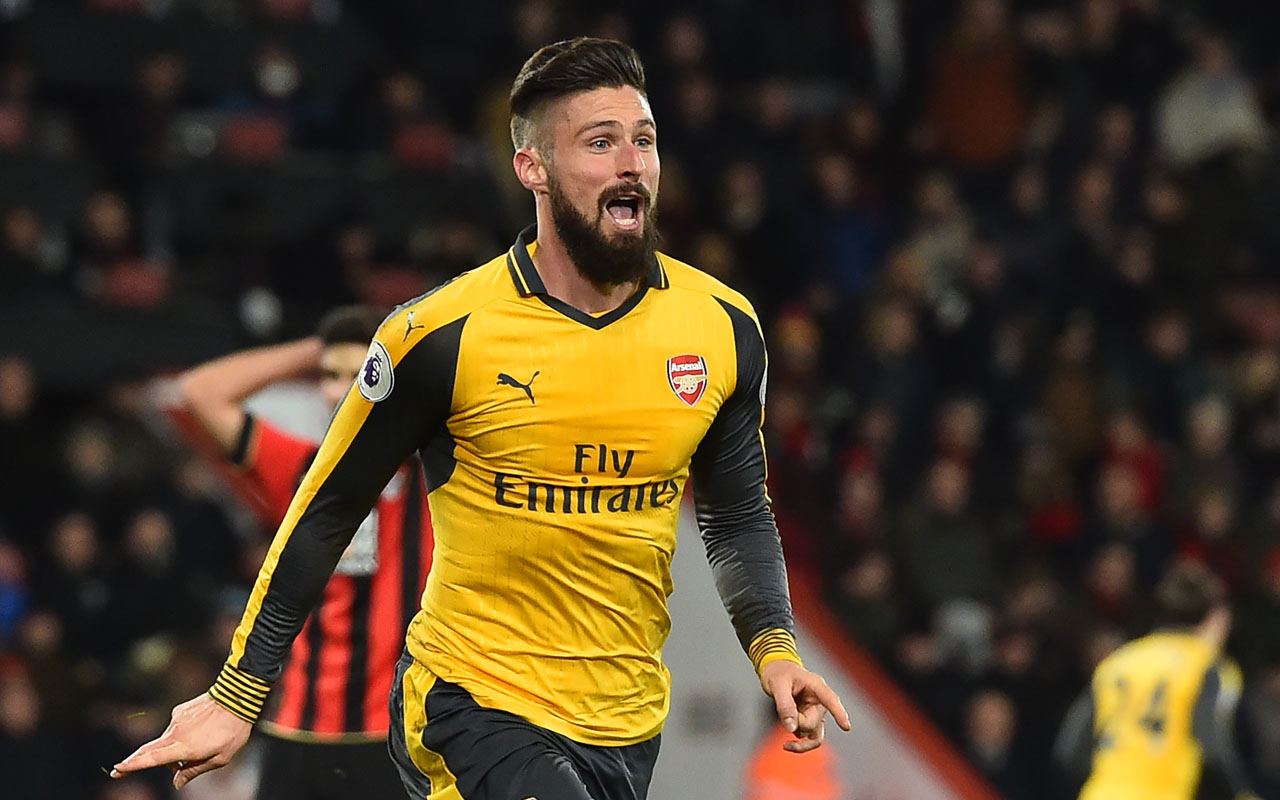 Arsenal's French striker Olivier Giroud celebrates after scoring their third goal during the English Premier League football match between Bournemouth and Arsenal at the Vitality Stadium in Bournemouth, southern England on January 3, 2017. The game finished 3-3. / AFP PHOTO / Glyn KIRK / 