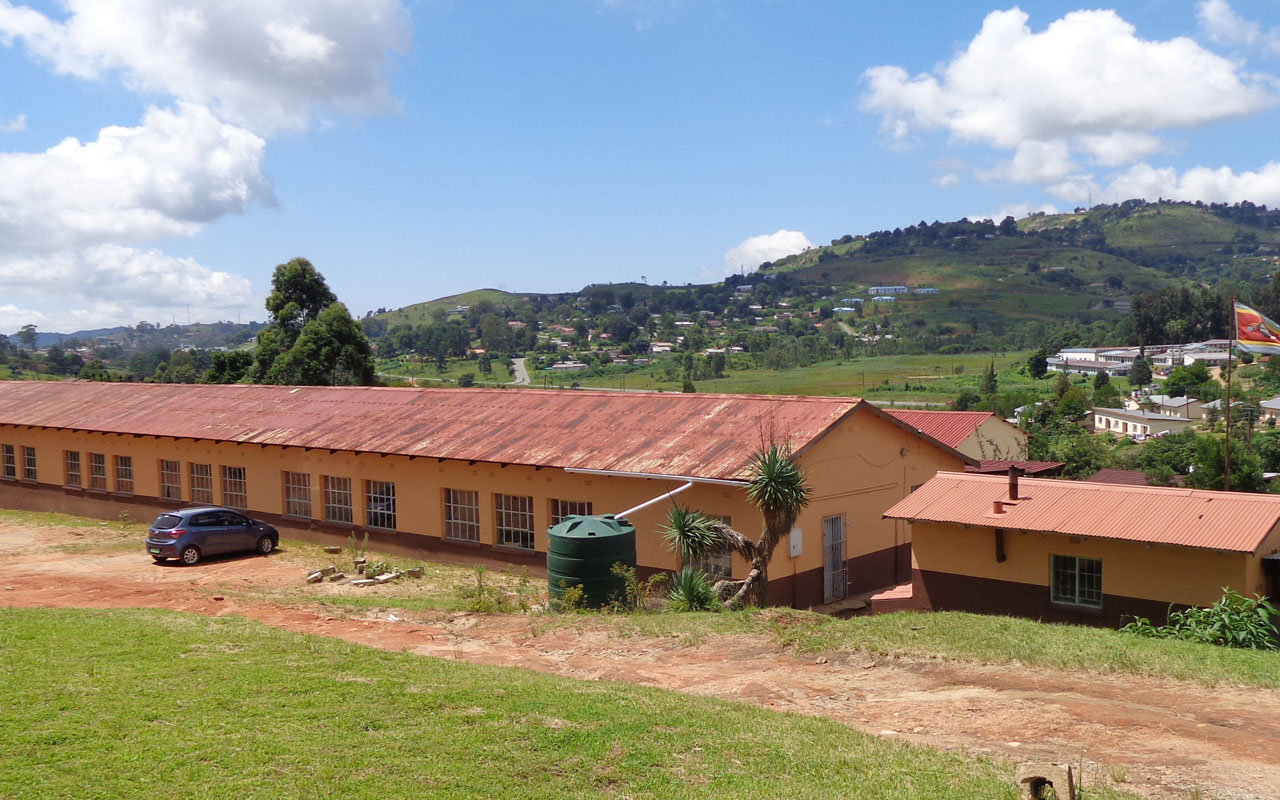 Kingdom of Swaziland flag flies on a mast by a public school on January 22, 2017 in Mbabane, Swaziland. Swaziland's schools opened for the new academic year on January 24, 2017 under new government orders to teach only Christianity, a move criticised by opponents as fuelling intolerance of Muslims. Officials said that old text books were being replaced with new ones that mention only the Bible, and that schools were required to submit a list of qualified religious studies teachers ahead of the start of term. / AFP PHOTO / STRINGER