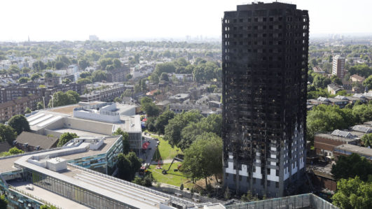 UK to probe widespread use of cladding after tower blaze