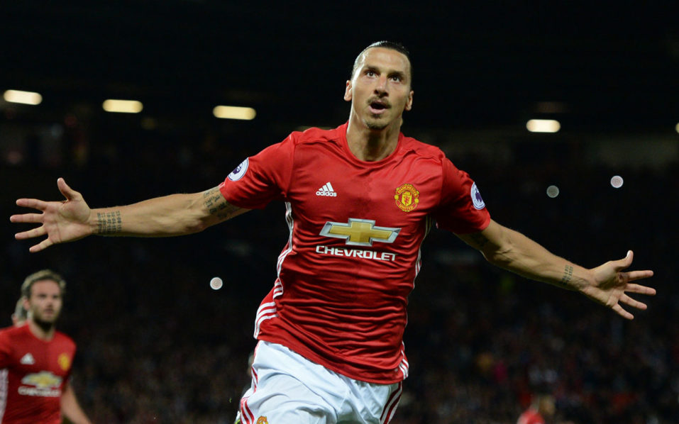 (FILES) This file photo taken on August 19, 2016 shows Manchester United’s Swedish striker Zlatan Ibrahimovic celebrates after scoring their second goal from the penalty spot during the English Premier League football match between Manchester United and Southampton at Old Trafford in Manchester, north west England, on August 19, 2016. Zlatan Ibrahimovic has rejoined Manchester United on a one-year contract on August 24, 2017 after the Swedish star’s spell with the Premier League side was curtailed by a serious knee injury last season. Ibrahimovic missed the final weeks of United’s campaign after suffering ligament damage in a Europa League clash against Anderlecht in April 2017. / AFP PHOTO / Oli SCARFF / 