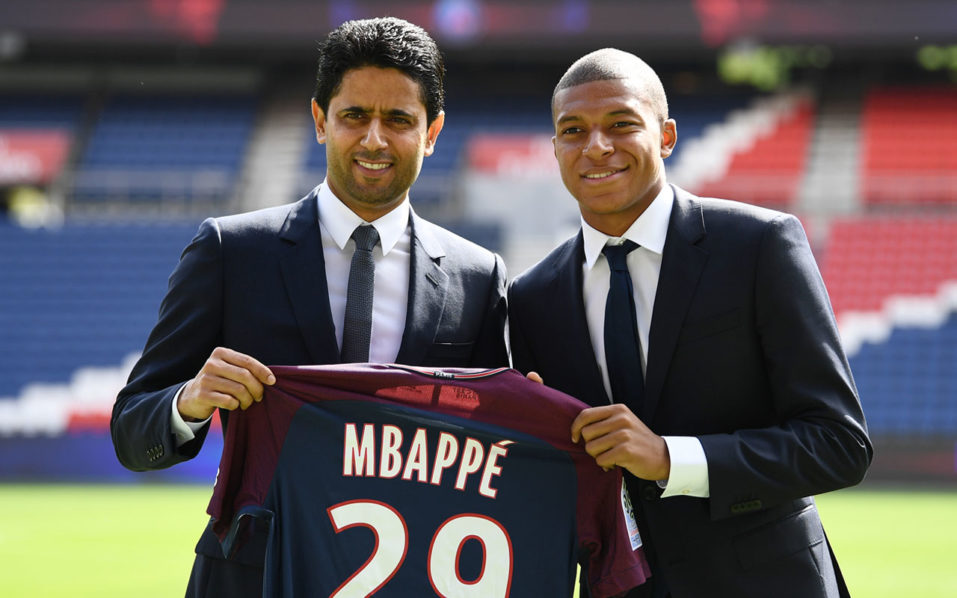 Paris Saint-Germain's new player Kylian Mbappe holds his jersey