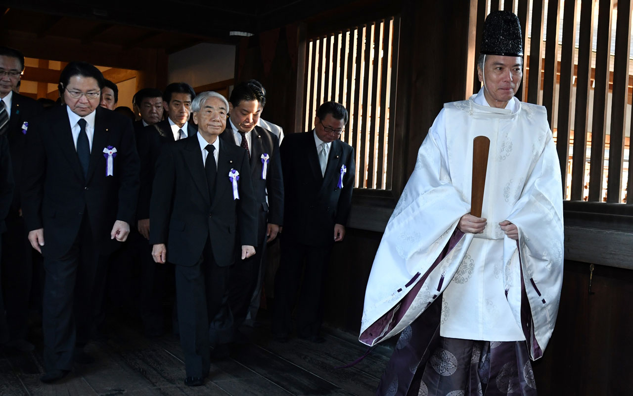 Dozens of Japan lawmakers visit controversial war shrine | The Guardian ...