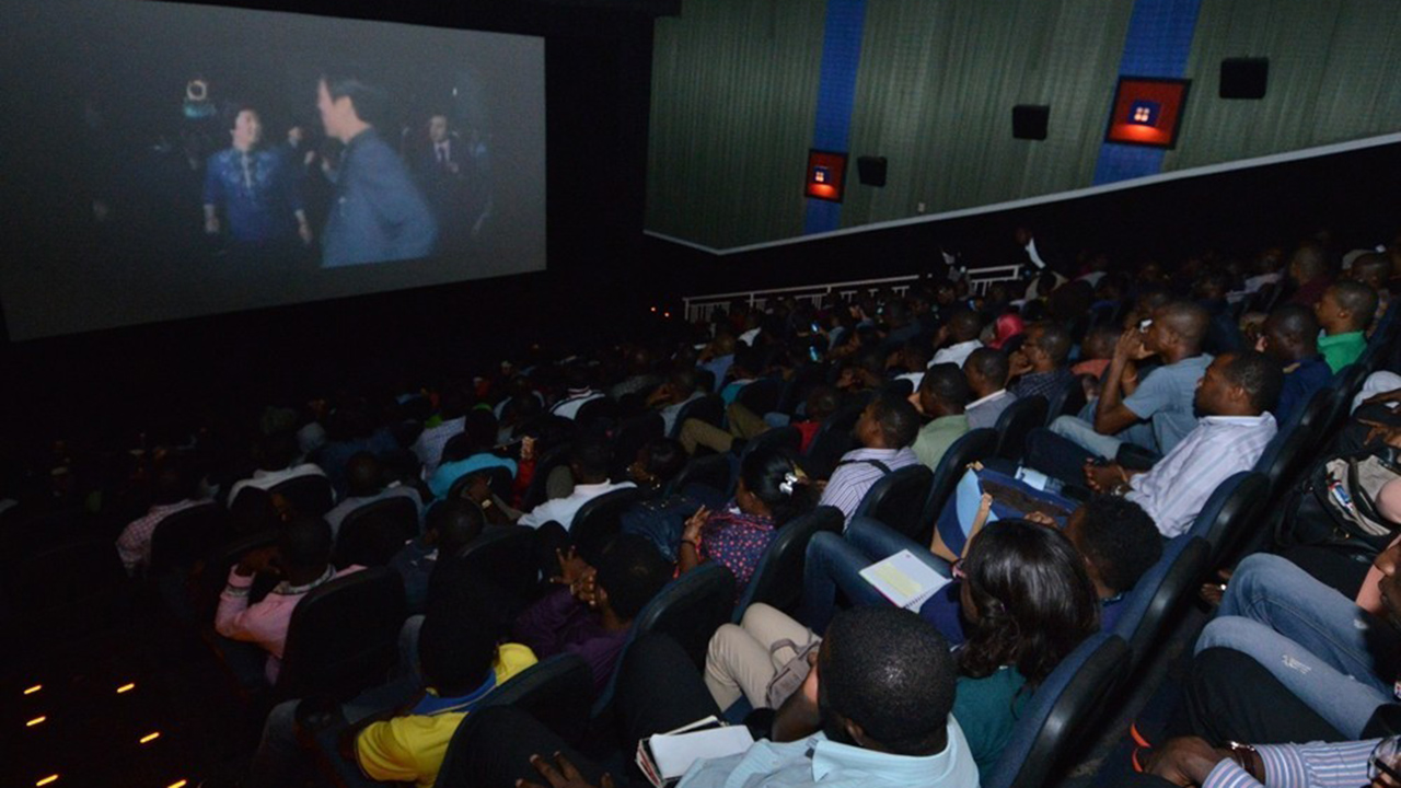 African audience in a cinema hall. [Image Credit: The Guardian Nigeria]