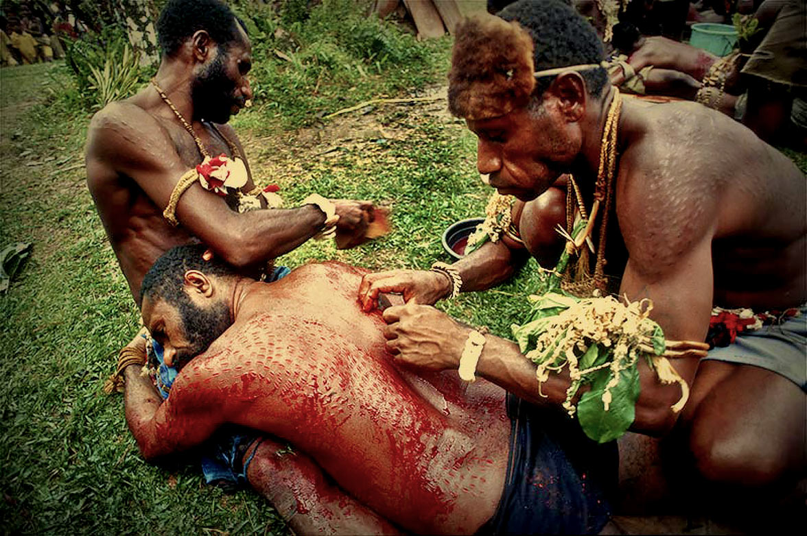 What is the Papua New Guinea crocodile skin-cutting ritual and who are the  Chambri people?
