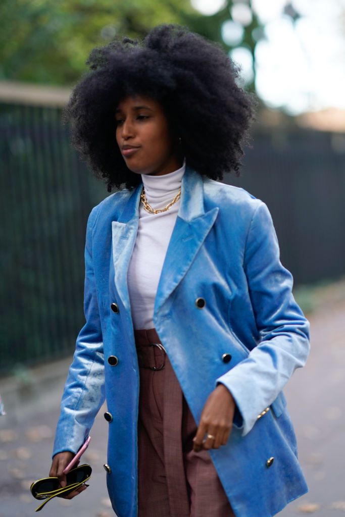 A model wearing a velvet oversized blazer