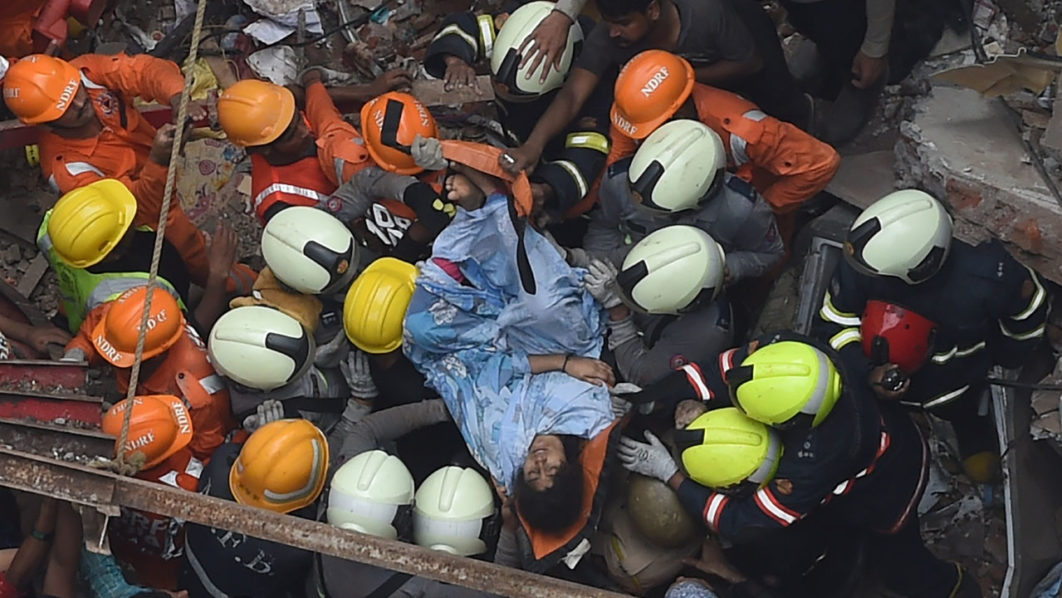 Two dead, over 40 trapped in Mumbai building collapse | The Guardian ...