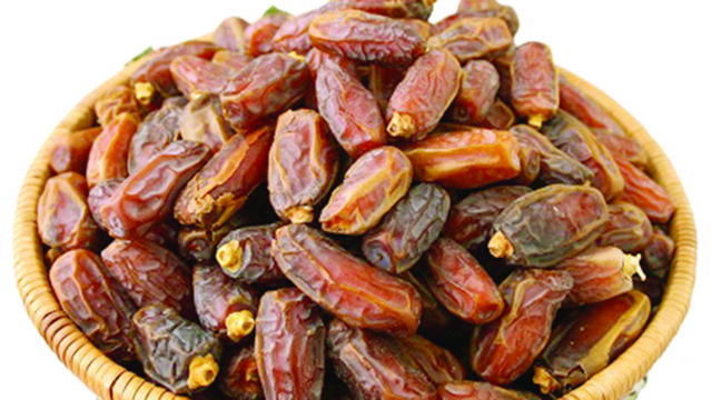 Closeup Of Date Fruit Against White Stock Photo, Picture And Royalty Free  ImageImage 32949678.