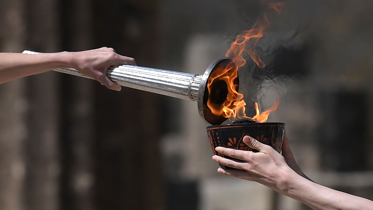 Tokyo Olympics flame festivities scaled back over virus — Sport — The ...