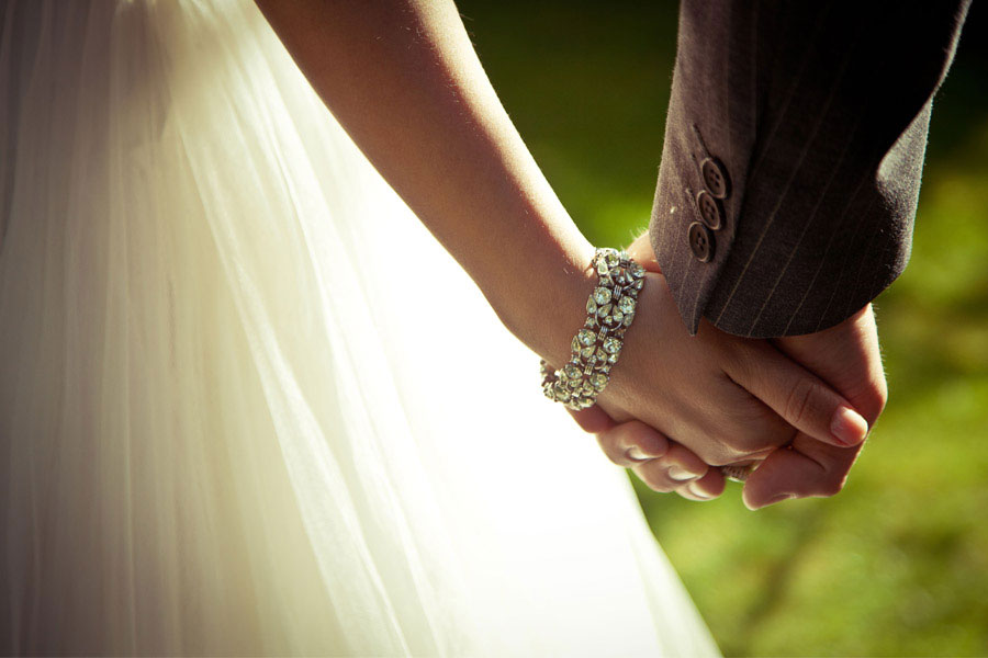 https://guardian.ng/wp-content/uploads/2020/09/Bride-and-groom-holding-hand-Photo-We-Hear-It.jpg