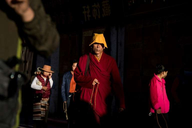 a group of people wearing costumes beijing insists it peacefully liberated tibet in 1951 and brought 201455