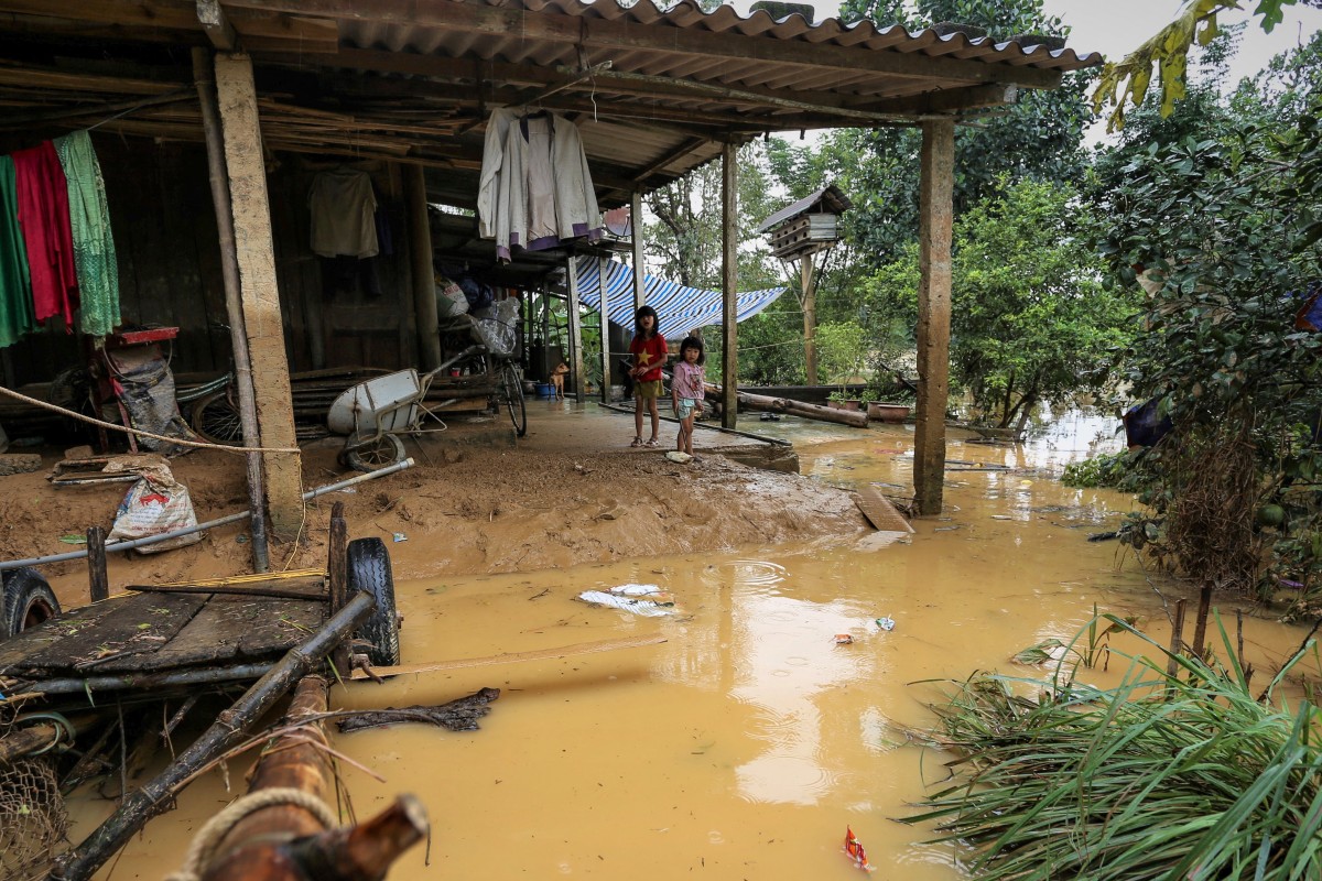 Thousands of homes underwater after floods hit Vietnam | The Guardian ...