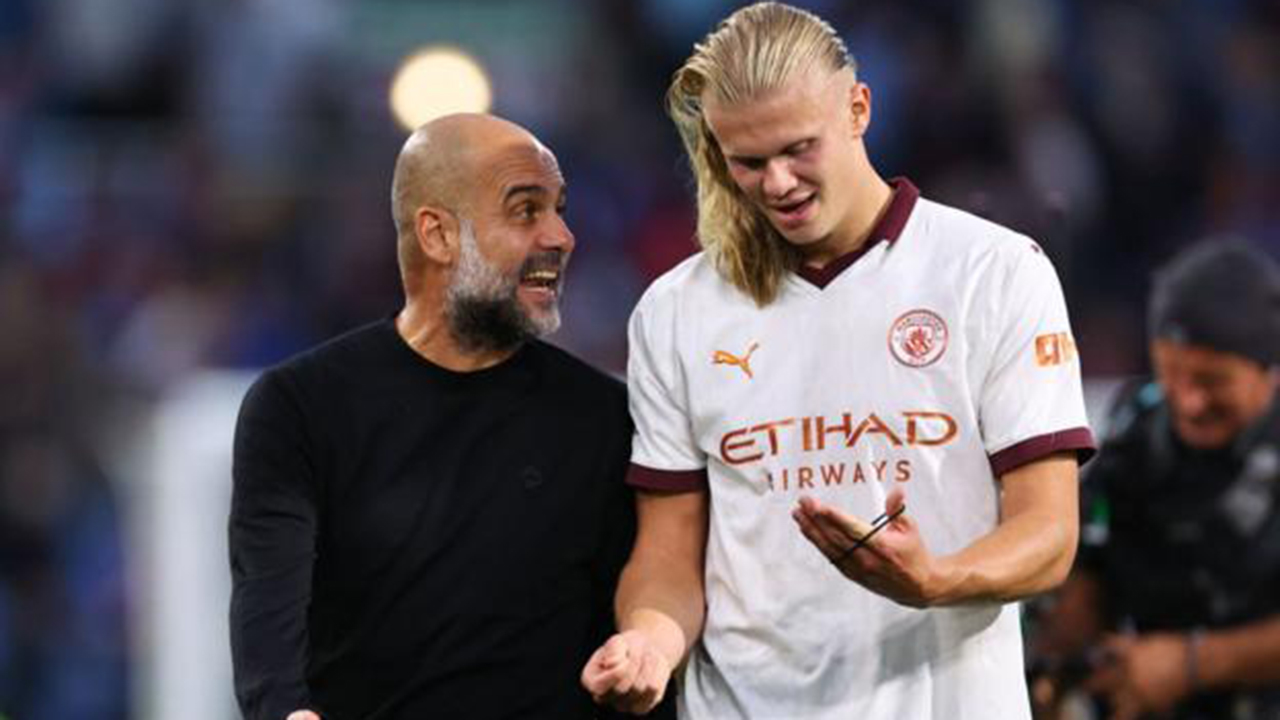 Pep Guardiola and Erling Haaland