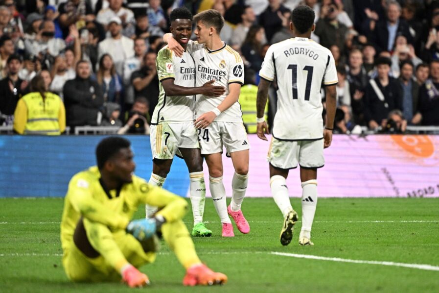 Real Madrid's Turkish midfielder #24 Arda Guler celebrates with Real Madrid's Brazilian forward #07 Vinicius Junior