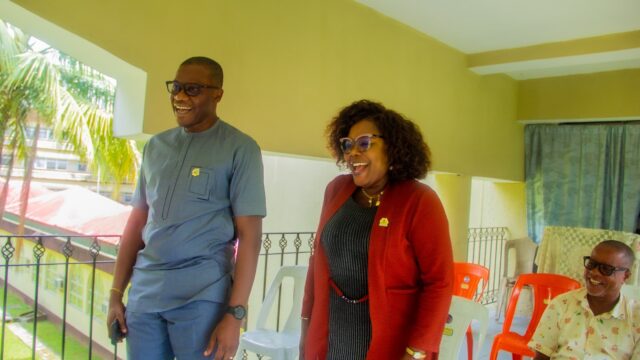 Akwa Ibom State Commissioner for Culture and Tourism, Sir Charles Udoh (left) welcoming the new the Permanent Secretary of the ministry, Mrs Grace Akpan, to office