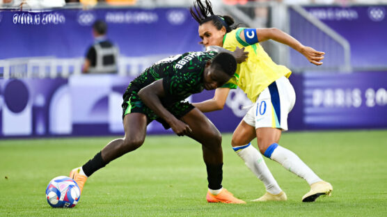 Nigeria's Christy Ucheibe (L) fights for the ball with Brazil's Marta during the Paris 2024 Olympic Games women's Group C football match between Nigeria and Brazil at the Bordeaux Stadium, in Bordeaux, on July 25, 2024.