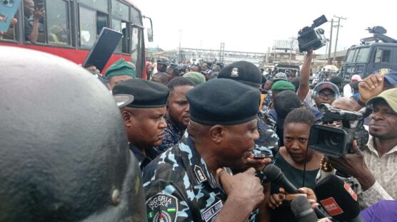The Lagos State Commissioner of Police, Fayoade Adegoke, addresses protesters at the protest scene in Ojota and assures them of their safety