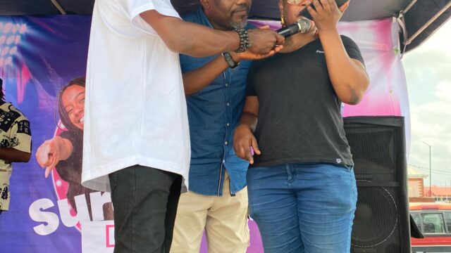 Dr Charles Akhenamen of Big Shot Lottery calling winners of SureShot Daily N100,000 draws at an activation over the weekend.jpeg