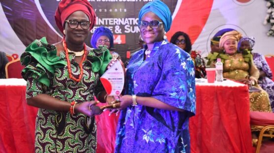 Imo State Deputy Governor, Dr. Chinyere Ekomaru (R) being presented with a prestigious award by the National President of the Stand-Up for Women Society (SWS), Lib. Mrs. Deborah Ijadele-Adetona during the group's annual International conference, held in Owerri, over the weekend