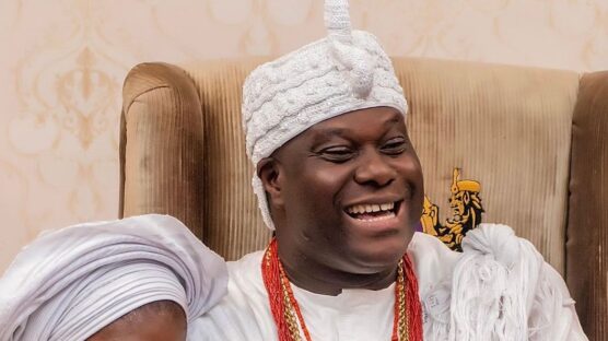 Ooni of Ife and wife Ashley sitting and smiling