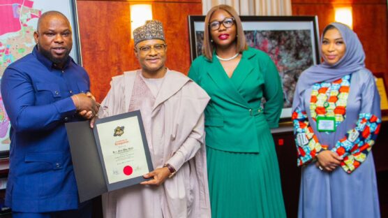 Governor Uba Sani of Kaduna State (second left) receives his 100 Most Notable Peace Icons Africa honour