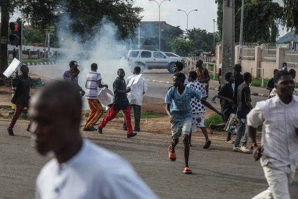 Protesters carry placards during an anti government demonstration in Lagos, on October 1, 2024.