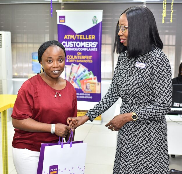 Executive Director, Risk Management, First City Monument Bank (FCMB), Mrs. Oluwatoyin Olaiya, served customers at the bank's McCarthy branch in Lagos. Pictured with Mrs. Olaiya is a customer, Mrs. Oluwaranti Adeniyi. 