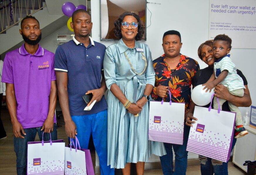 Mrs. Funmi Adedibu, Non-Executive Director, First City Monument Bank (FCMB), engaged with customers and showed appreciation for their support. Pictured with Mrs. Adedibu at the bank's Alfred Rewane Road branch in Lagos are, Onoje Ochai, Ahmed Shehu, Christian Eddie and Blessing Chiekwe.