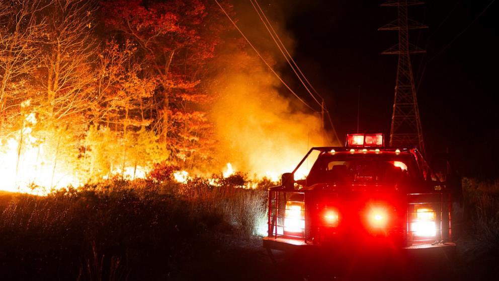 Firefighters have been grappling with a blaze that has destroyed over 130 homes in the California wildfire as winds dropped 