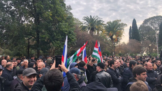 Protestors stormed the regional parliament in Abkhazia on Friday, forcing the government to halt an investment deal with Russia